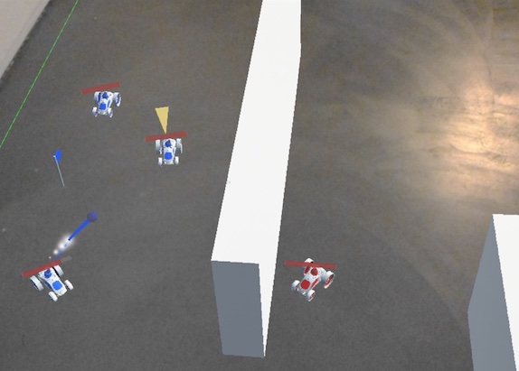 A screenshot of the Buggy Blasters HoloLens game prototype, showing the multiplayer gameplay with buggies of the red and blue team driving around in the PreviewLabs office.